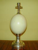 Pair of Ostrich Eggs and silverered metal Candlesticks
