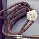 SALE Bolo with a coin on it.