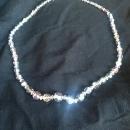 A classy string of silver-toned crystal beaded necklace