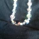 A classy string of silver-toned crystal beaded necklace