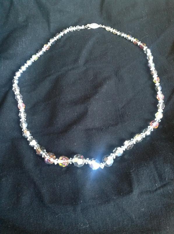 A classy string of silver-toned crystal beaded necklace