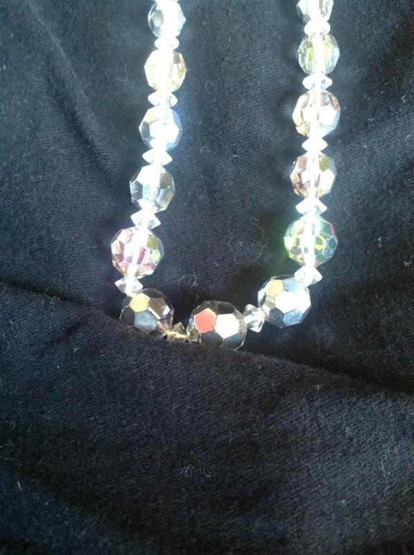 A classy string of silver-toned crystal beaded necklace