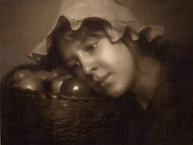EG Studio (attrib.): Woman with Basket of Fruit