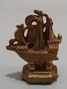 Cast mini Sail boat paperweight.