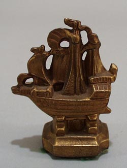Cast mini Sail boat paperweight.