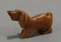 Dashound carved stone animal.