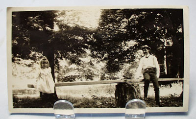 Old Photo of Man and little girl on teeter totter.