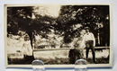 Old Photo of Man and little girl on teeter totter.