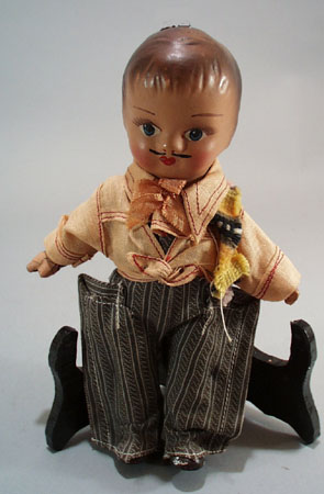 Pr of Composition dolls, larger souvineer type.
