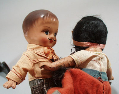 Pr of Composition dolls, larger souvineer type.