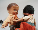 Pr of Composition dolls, larger souvineer type.