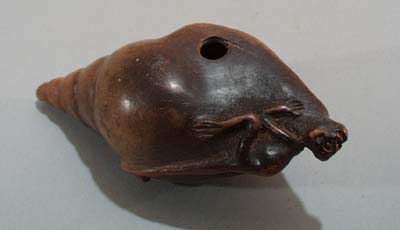 Monkey on shell pipe.