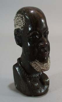 Carved stone bookend of Tribal man