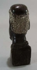 Carved stone bookend of Tribal man