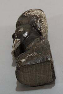Carved stone bookend of Tribal man