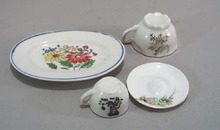 4 pc childs dishes, a platter, 2 cups and a saucer