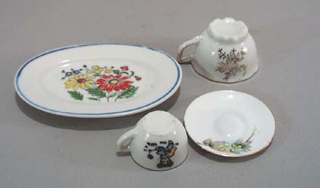 4 pc childs dishes, a platter, 2 cups and a saucer