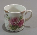 Old porcelain mug with great unusual pattern in porcelain.