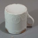 Old porcelain mug with great unusual pattern in porcelain.