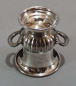 Silver Coffer 10 is on the back of this little double handled urn.