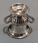 Silver Coffer 10 is on the back of this little double handled urn.