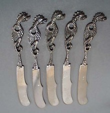 5 dragon handled butter spreaders.