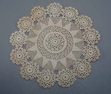 Tiny stitched crochet doily.