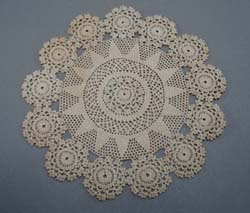 Tiny stitched crochet doily.