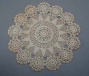 Tiny stitched crochet doily.