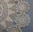 Tiny stitched crochet doily.