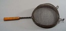 Yellow/brown bakelite handle strainer