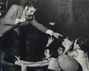 Picture of Elvis With Mike and Pointing to Fan 1956
