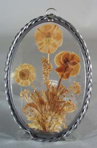 Leaded glass suncatcher with real pansy inside.