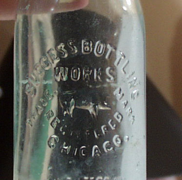 Success Bottling Works Bottle, shows pig