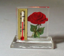 Lucite holder Thermometer with red rose.