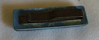 Tie clip made of a blue plastic