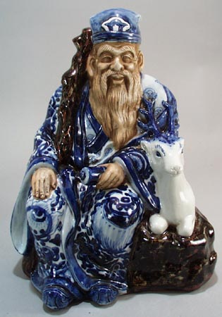 Wise Oriental man & reindeer, old, has cloth impressed bottom