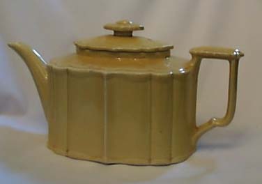 Oriental Porcelain yellow teapot, neat shape.