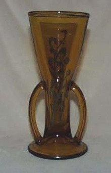 Double handled amber vase with silver flower