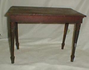 Old red paint doll table