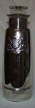 Mercury glass bottle, has crest on the front.