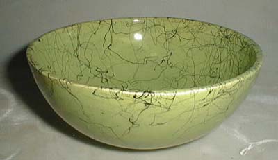 Splatterware cereal bowl in green and black