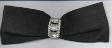 Black ribbon bow with rhinestone pin. Pin is