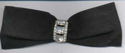 Black ribbon bow with rhinestone pin. Pin is