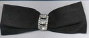Black ribbon bow with rhinestone pin. Pin is