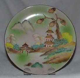 Moriage on porcelain plate Japan pagoda scene