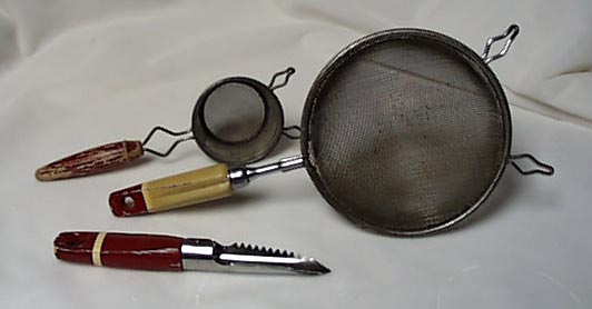 3 red handled utensils