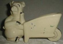 Shawnee ? pig with wheelbarrow planter