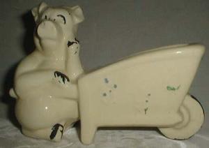 Shawnee ? pig with wheelbarrow planter