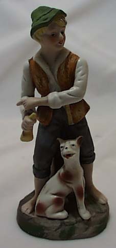 Bisque porcelain boy, dog & bone figurine